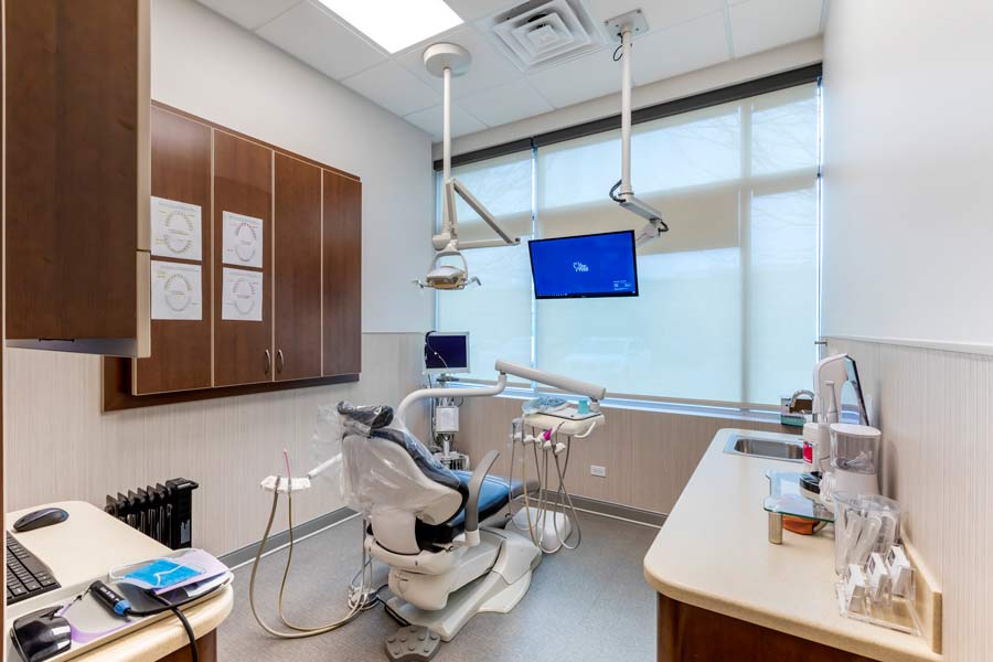 Back view of dental exam room with dental chair at Glen Perio in Glenview, IL