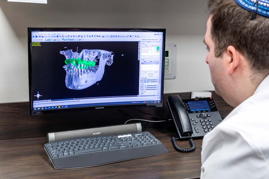 Dr. Joshua Hassan examining digital impression at Glen Perio in Glenview, IL 