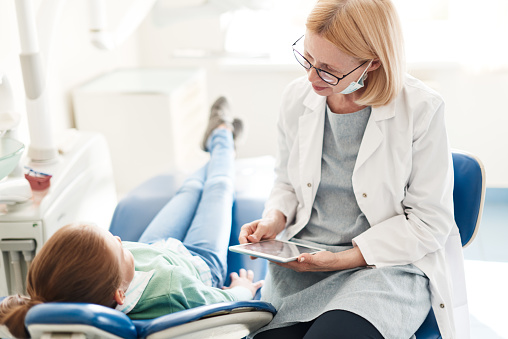 Dentist discussing treatment with patient