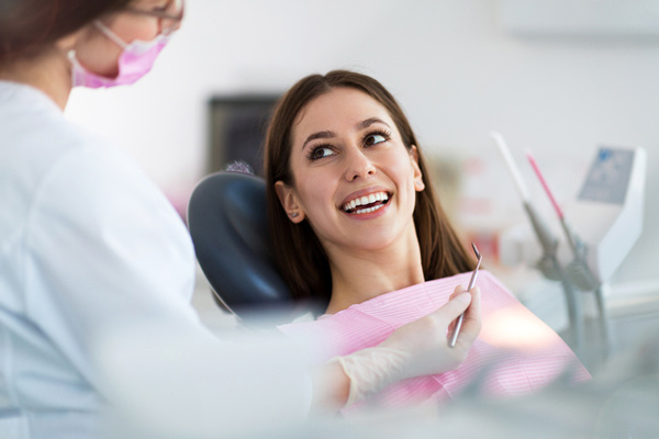 Woman smiling in a dental chair.